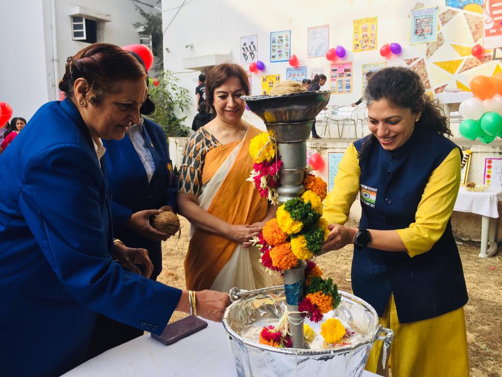 Ms. Aparna lights the ceremonial Torch